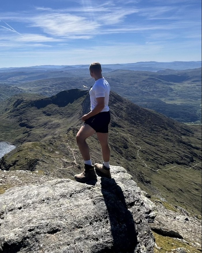 Louis Lanaway on a mountain summit